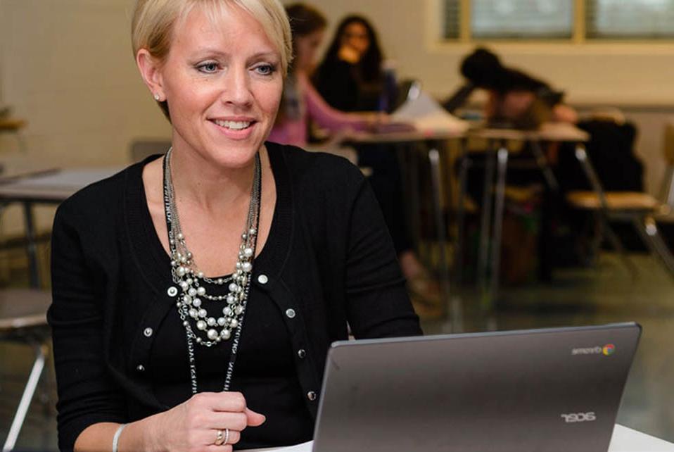 a teacher working with highschool students